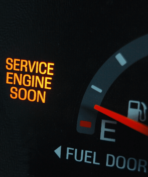 A check engine light lit up on a car's dashboard