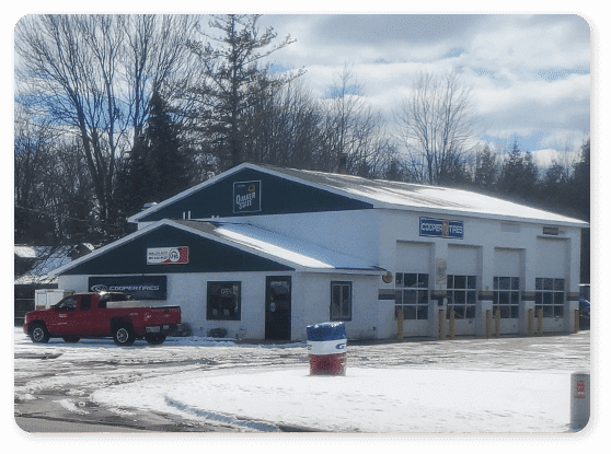 auto repair in hemlock mi at Hemlock Auto & Alignments, image of shop in winter months with red truck parked in front
